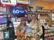 Tiffany Snowden (left) and JJ's Newsagency owner Jessica Fischer (right) with the $1M Division 1 Lotto ticket notice. 
