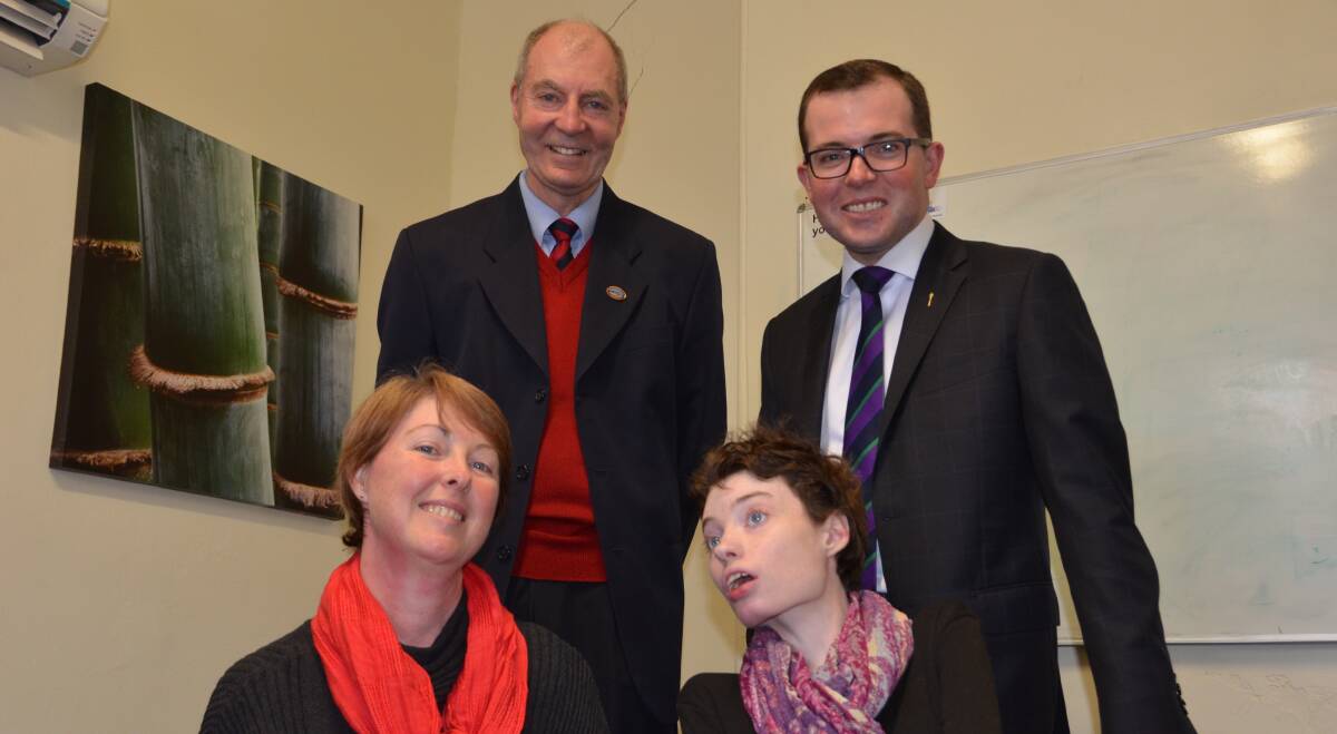 HELP: Care for Children with Disability manager Rob Richardson, MP Adam Marshall with Vicky and Evie Logan who will benefit from the new NDIS.