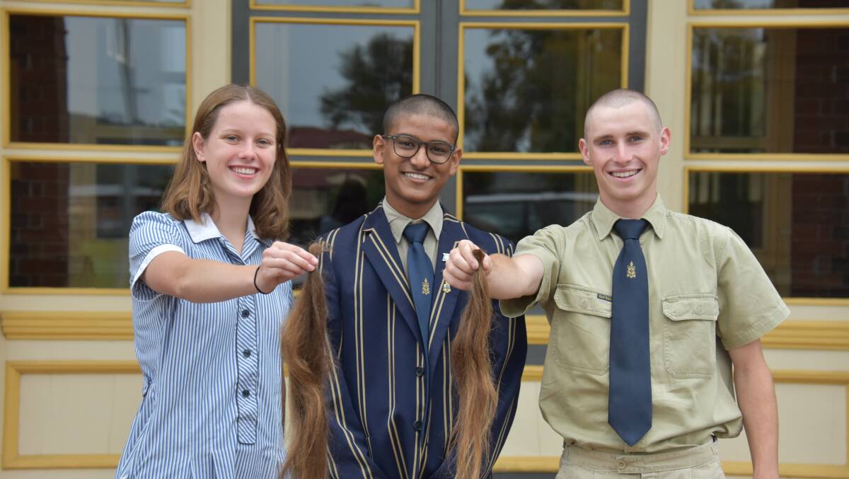 FUNDRAISER: The Armidale School prefects Kitty McPhie, Sambavan Jeyakumar and Nicholas Farrar bravely lost their locks for charity last week.