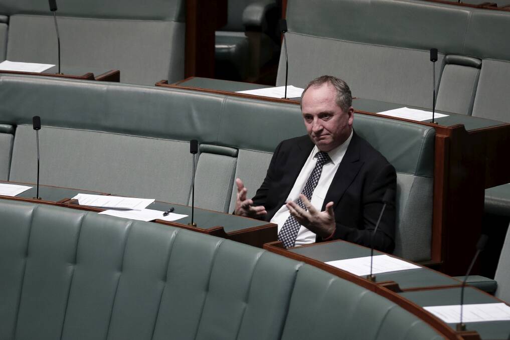 NO SNIPING: Barnaby Joyce takes his seat on the backbench. Photo: Alex Ellinghausen