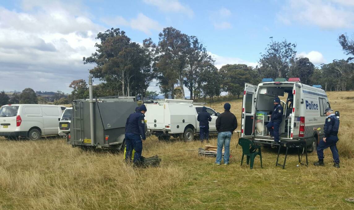 Difficult terrain: Local police as well as forensic officers at the staging area for the operation in the Wild Rivers National Park near Armidale.