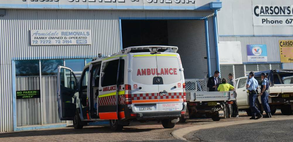 Crime scene: Police and detectives at the scene of the alleged armed robbery at a removals business in Armidale on August 11. Photo: Rachel Baxter