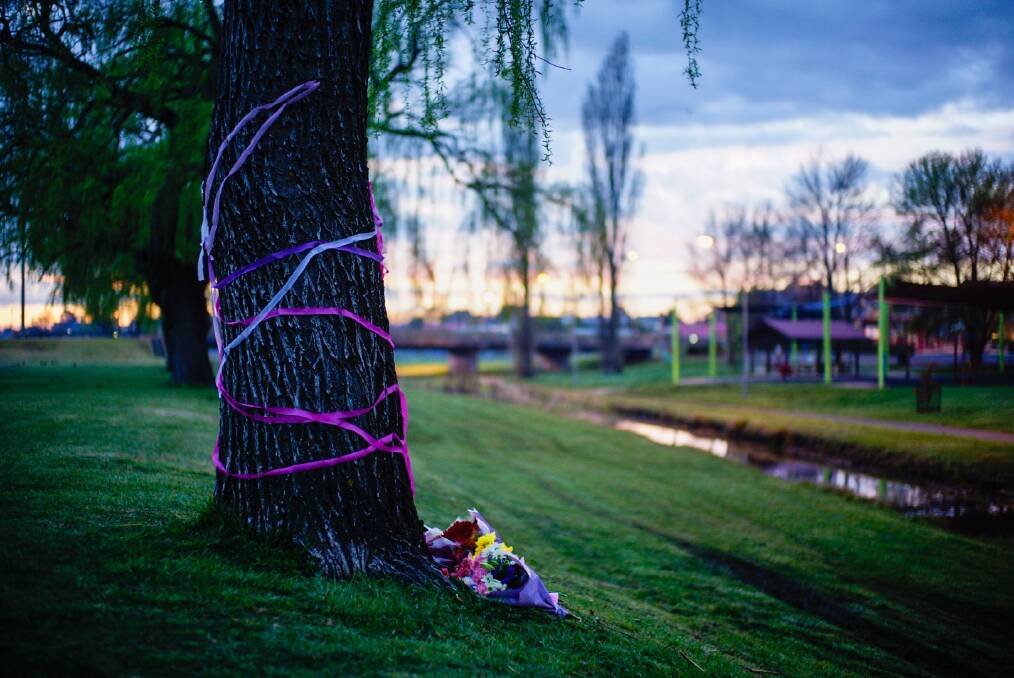 Inquest: Tributes at the scene of the drowning at Armidale Dumaresq Creek in September. Coroner Michael Holmes will examine the young girl's death at an inquest in 2017. Photo: Matt Bedford