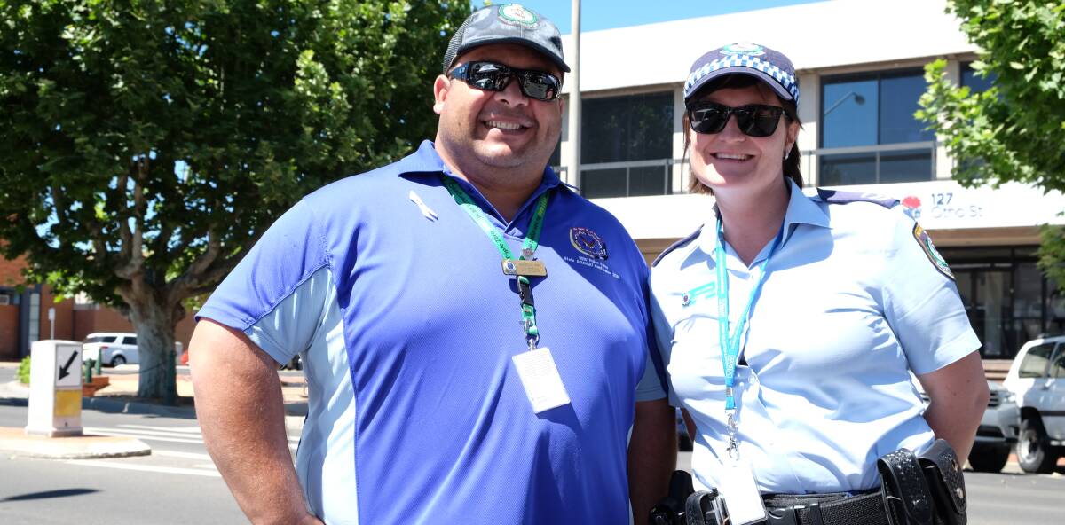 Help available: Aboriginal Liaison Officer William Green and DV Sen Const Lauren Wheeler at the White Ribbon March. Photo Michèle Jedlicka