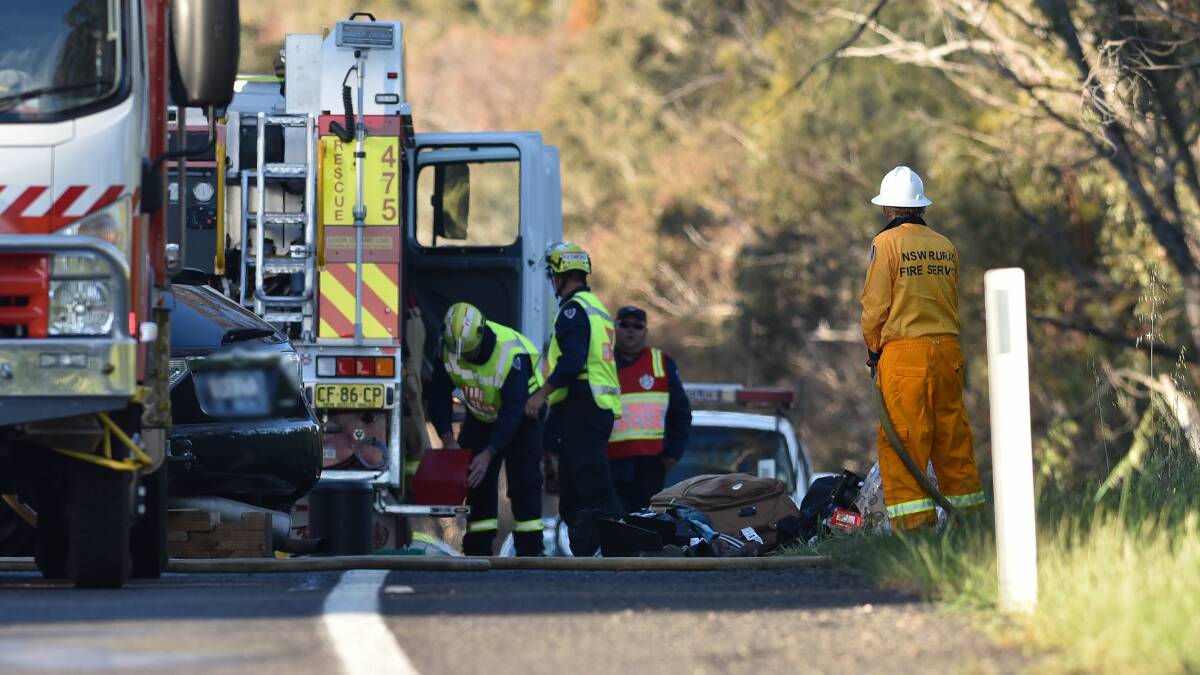 Horrific scene: Emergency services at the scene of the double fatal crash which shut the New England Highway between Uralla and Bendemeer for several hours. Detectives are trying to determine the cause. Photos: Gareth Gardner 