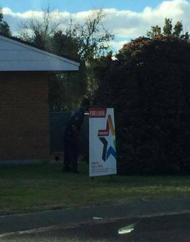 Search on: A police officer watches on at the search for Kenneth Pitt who was spotted in Bailey Cr, Armidale, on May 31. Photo: Madeline Link