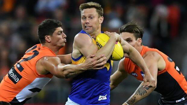 Sam Mitchell takes on two Giants defenders. Picture: AAP