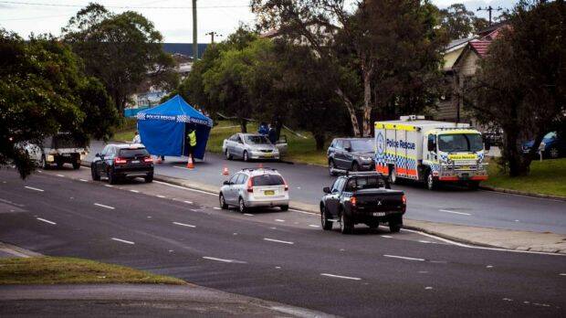 Police set up a crime scene after finding the body of a man in the back seat of a car in Newcastle. Photo: Simon McCarthy
