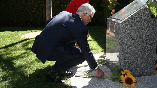 Prime Minister Malcolm Turnbull at an MH17 memorial in the gardens of Parliament House in Canberra. There will now also be a memorial in Amsterdam, where the ill-fated airliner took off. Photo: Alex Ellinghausen
