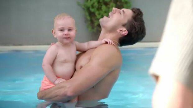 Matty J topless holding his baby nephew. Photo: Ten
