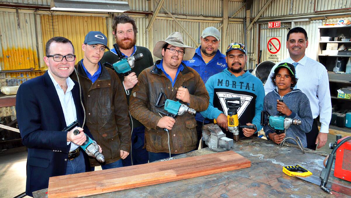 POWER ON: Students and staff at BackTrack check out their new power drills with MP Adam Marshall and David Crough from Essential Energy.