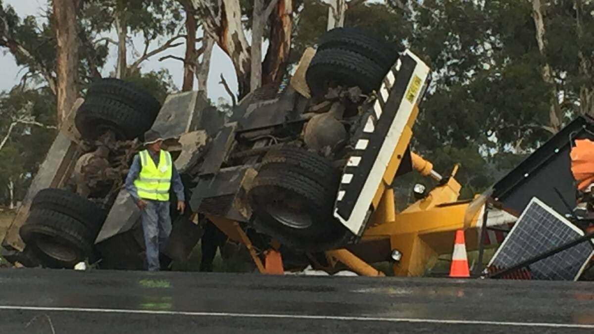 The LED-light sign appears to have tipped over next to the New England Highway.