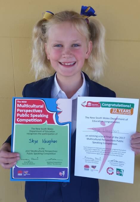 Skye Vaughan with her certificates for winning the competition.