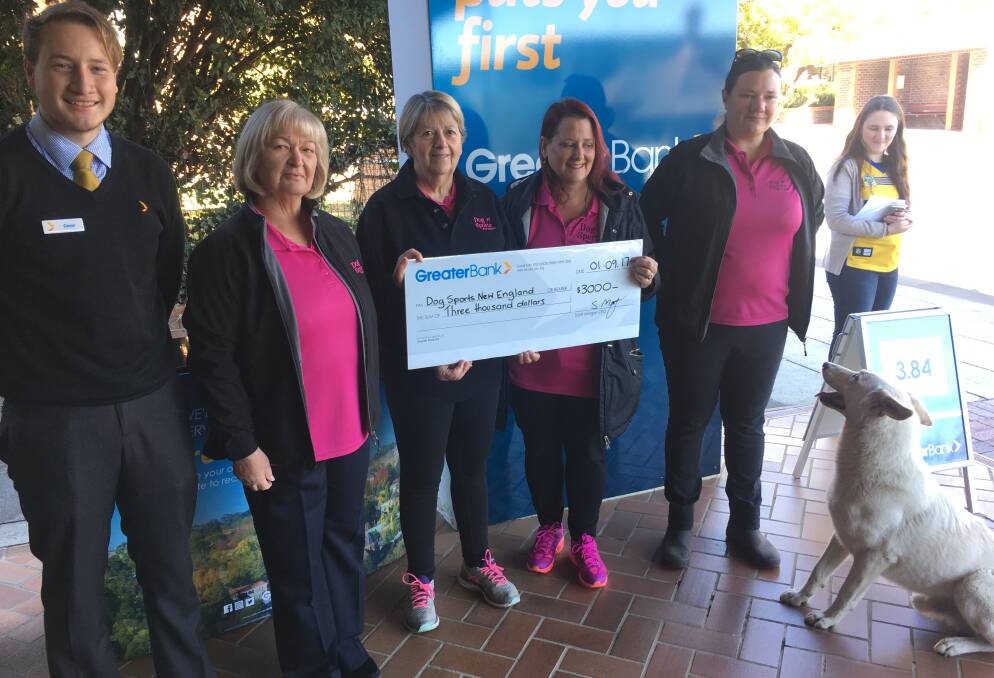 Greater Bank’s Conor MacGregor along with Dog Sports New England’s Lorna Patton, Ros Palmer, Sonya Glavac and Rachel Devenish-Meares, as well as Tara Alford from 2AD & FM100.3 Radio at the cheque presentation.