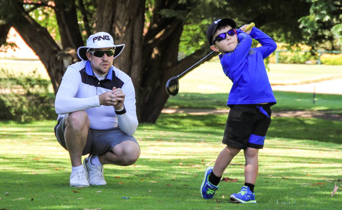 YOUNG AND TALENTED: Isaac Riches on course with Armidale Golf Club pro Andrew Walkley. Isaac features in a Golf Australia video, which caught the attention of World Number 1 Jason Day.