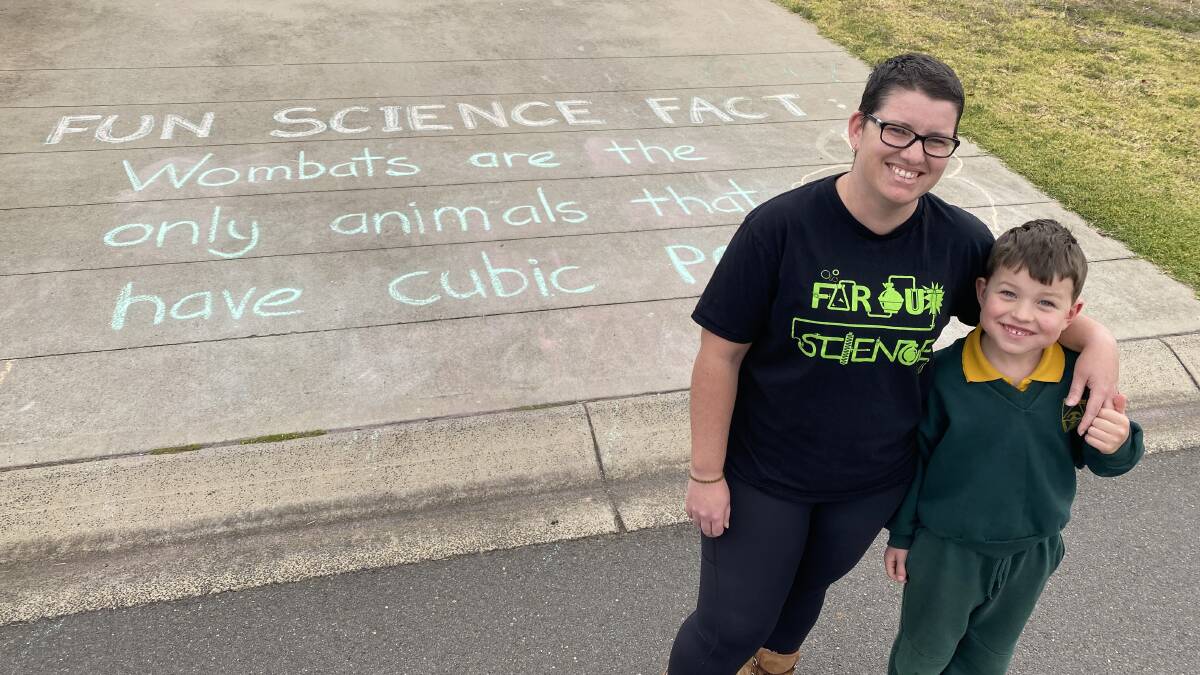 FUN FACTS: Science lecturer Mary McMillan and son Hamish have been sharing science lessons in the driveway. Picture: Laurie Bullock