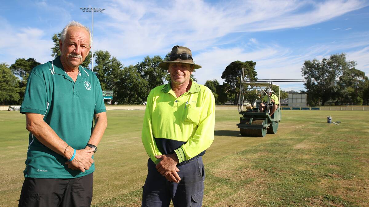 Mike Porter from the Armidale and District Cricket Association with Council staff member Malcolm Tremayne with one of the old rollers that will be replaced.