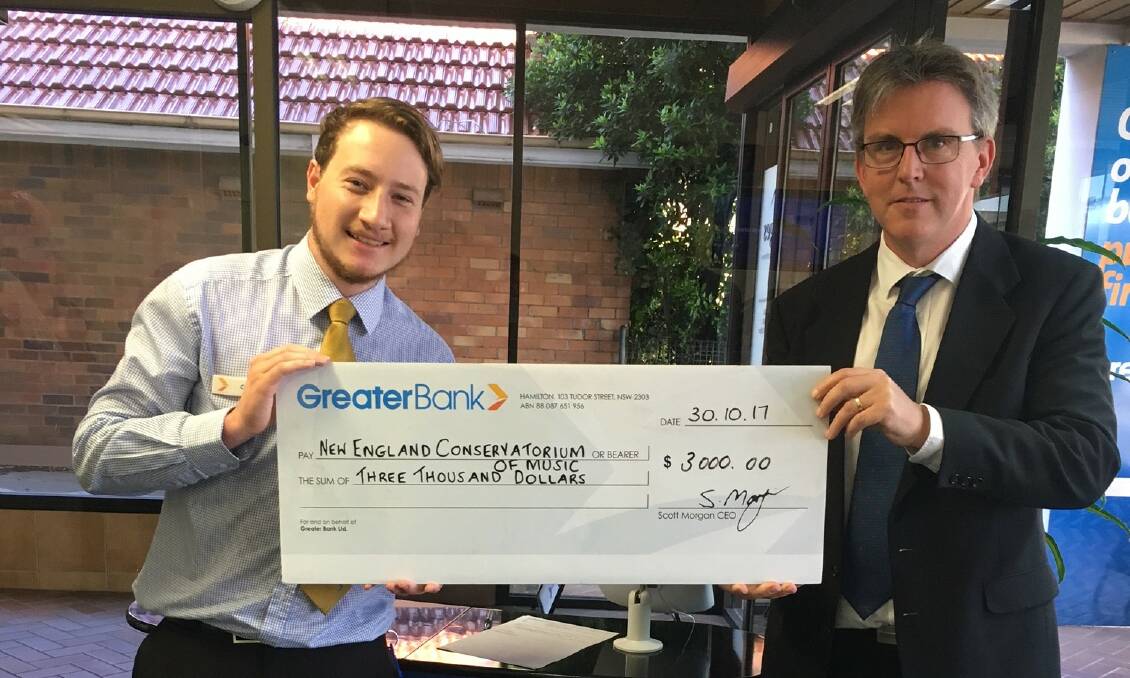 Greater Bank’s Conor MacGregor hands over the cheque to Director of New England Conservatorium of Music, Russell Bauer.