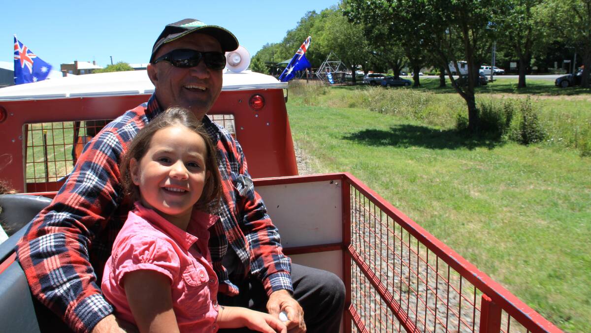 Sharnahleiah Bishop of Guyra and uncle Ron Bishop of Sydney enjoy a train ride at Guyra's Lamb and Potato Festival on Wednesday.