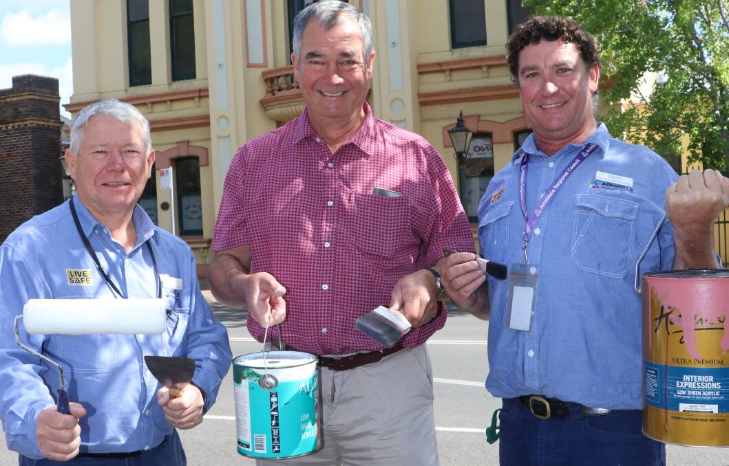 Armidale Regional Council caretaker Mike Riordan, mayor Simon Murray and caretaker David McMillan with paint and tools at hand, in preparation for this month’s repainting of Armidale Town Hall.