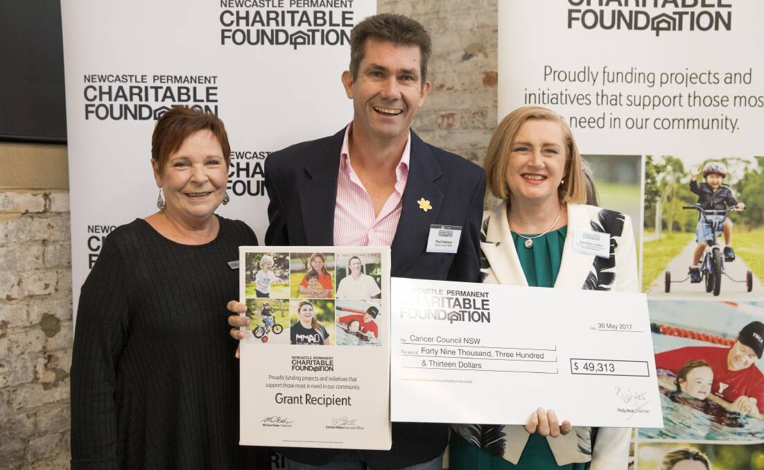 DONATION: Newcastle Permanent Charitable Foundation director Julie Ainsworth, Paul Hobson from Cancer Council NSW, and Charitable Foundation director Jennifer Leslie.