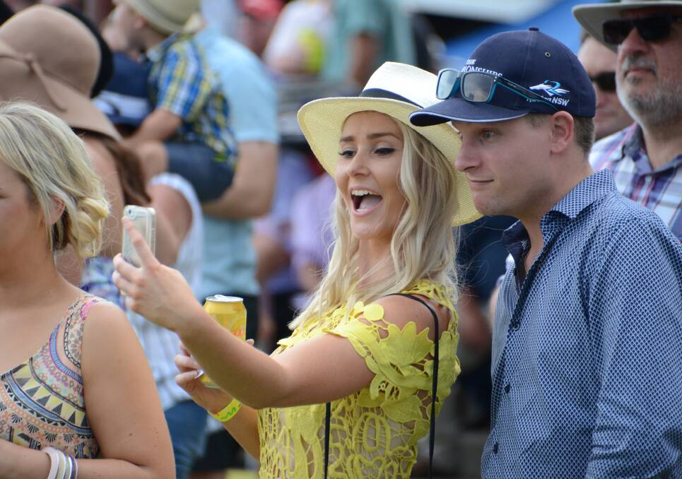 GRAB A HAPPY SNAP: Racegoers don't miss an opportunity to capture the fun on camera while all dressed up at the 2017 Glen Innes Cup over the weekend.