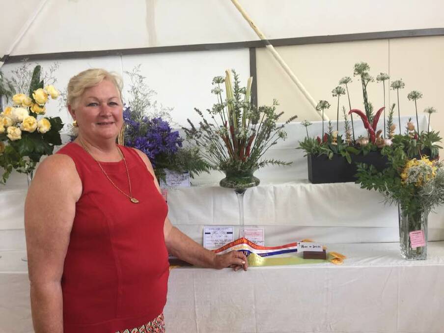 CHAMPION EFFORT: Helen McKemey takes out a champion sash for her chili, garlic, lavender and lemon grass arrangement at the 2017 Guyra Show.

