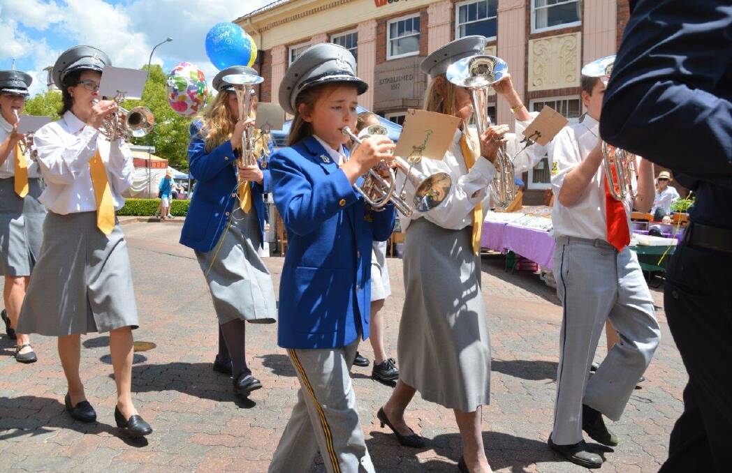 March to the beat: Musicians from across the region march at Armidale's Markets in the Mall on Sunday morning as part of a two-day brass band marching workshop.