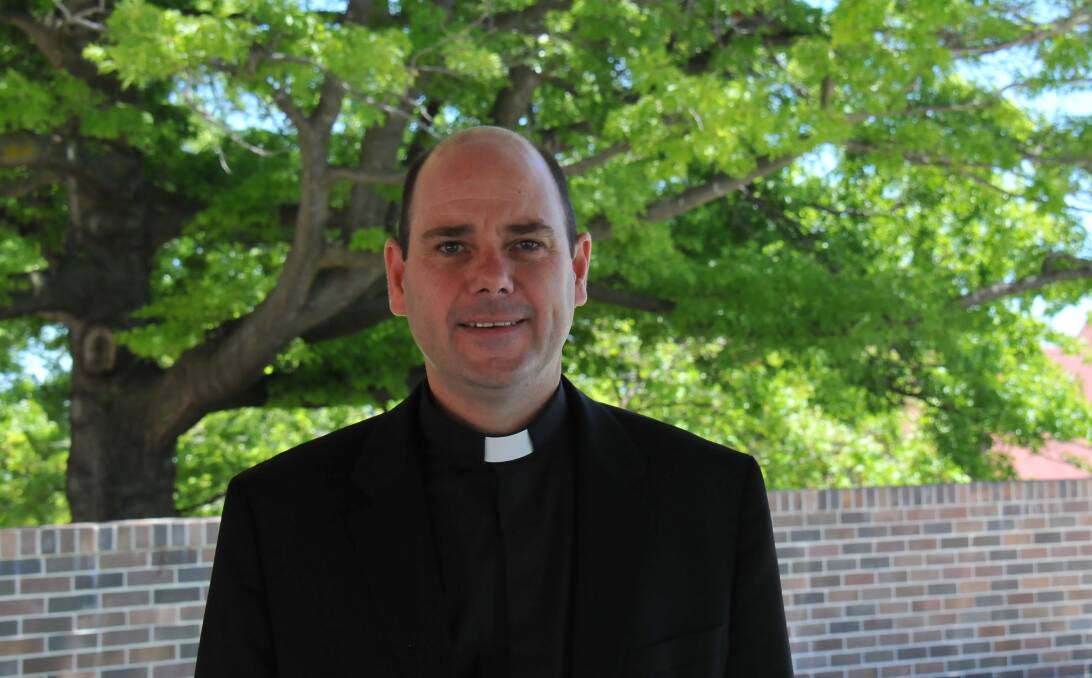 New memorial: Catholic Diocese of Armidale’s Bishop Michael Kennedy will take the ribbons off the fence at the Armidale Catholic Cathedral and place them on a new, permanent memorial in the church grounds on December 4.