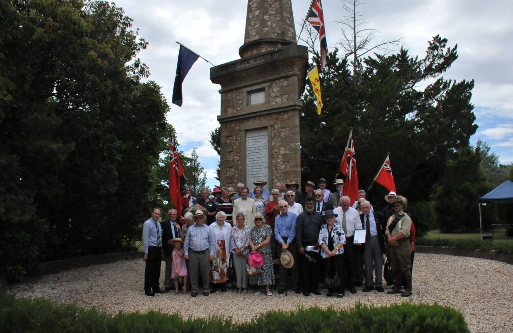 Heritage celebration: Members of the community, council and the Office of Environment and Heritage gather around the Dangersleigh War Memorial on Monday to celebrate the heratige listing of the structure.