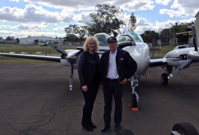 Flying start: Angel Flight pilot and former RBA governor Glenn Stevens with Angel Flight CEO Marjorie Pagani prior to take-off for the organisation's 20,000th mission.