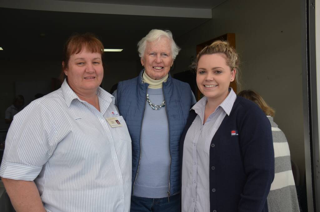 CELEBRATING: Cherie Hunter, Val Terbutt and Cassandra Robertson join a crowd of staff and auxiliary volunteers at the morning tea. The Uralla and Armidale auxiliaries raised $52,000 for equipment in the past 18 months.