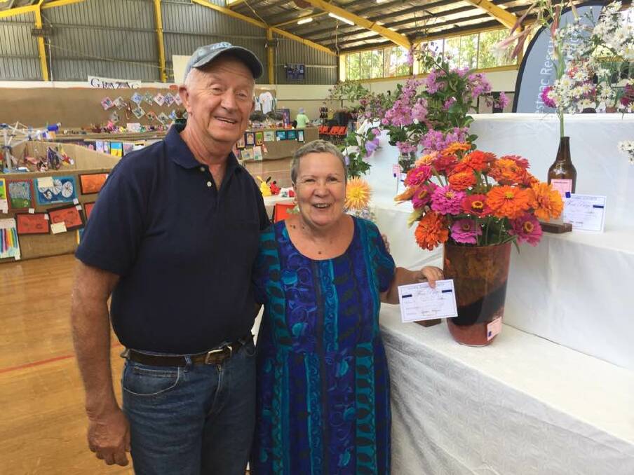 NEW FACES: Michael and Diane Rodgers win first prize in the miscellaneous display with their zinnias at the 2017 Guyra Show.