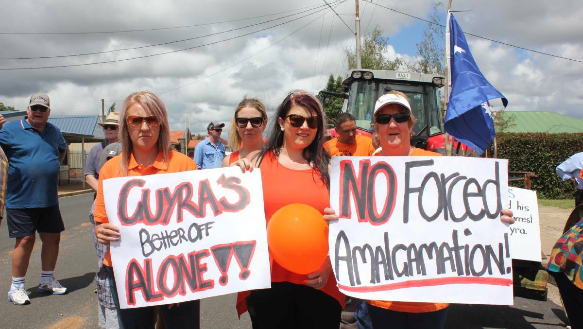KEEPING UP THE FIGHT: Tara Mendes, Katrina Rolff and Debbie Mendes at an anti-amalgamation rally in Guyra earlier this year. Photo: Madeline Link.