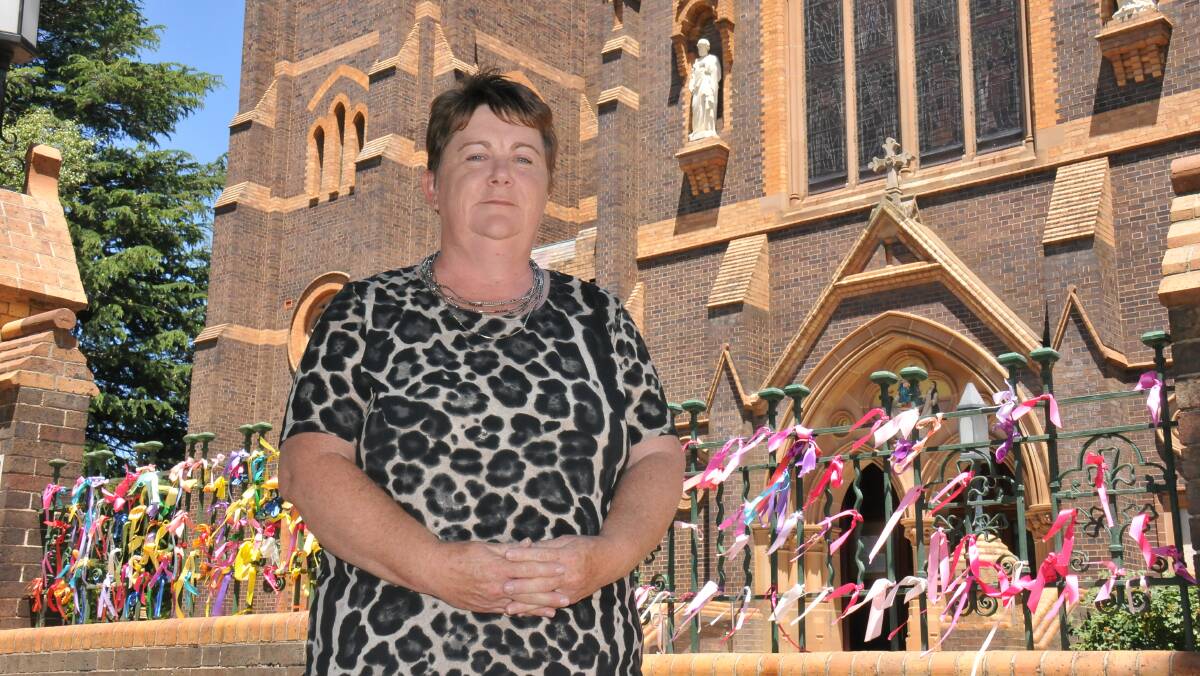 Bishop's backflip: Sexual abuse survivor and Loud Fence advocate Robyn Knight is pleased with Catholic Diocese of Armidale’s Bishop Michael Kennedy's decision to leave ribbons on the Armidale Catholic Cathedral fence.