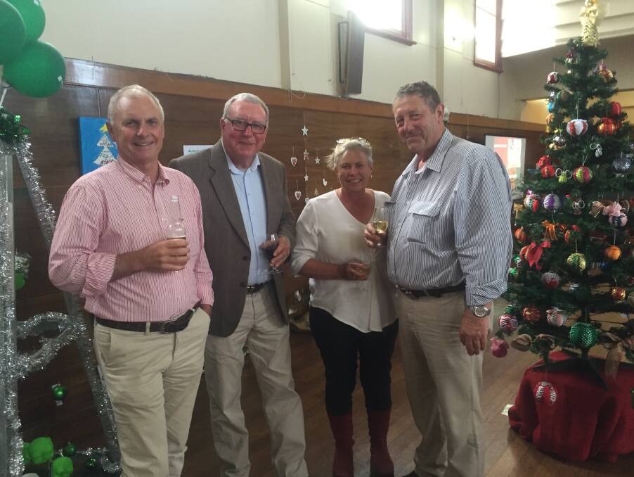 DECK THE HALLS: Graham Price, Mike Norton, Rose Price and Jim Ritchie at the Glen Innes Red Cross Christmas Tree opening on Friday.