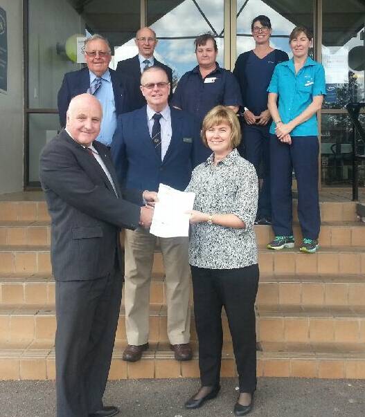 Big donation: Members from Masonic Care presenting representatives from the Armidale Rural Referral Hospital with a cheque for a new mophine driver on Friday.