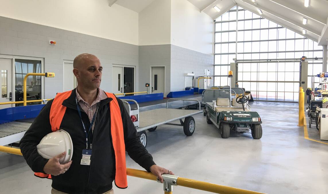 TAKING OFF: Armidale Regional Airport terminal upgrade project manager Ned Mozzell in the new baggage handling area.