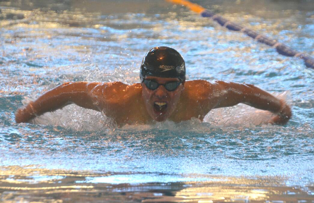 MAKING WAVES: Jesse Streeting, pictured competing in a butterfly event, was a standout performer for the Alligators, winning a medal in every one of his events. 