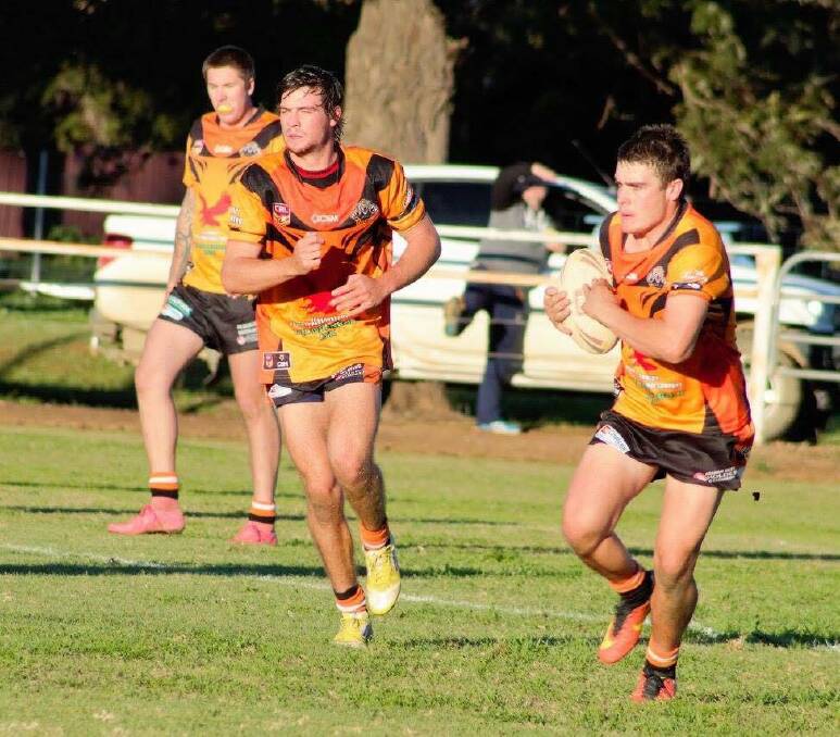 FIGHT BACK: Brody Dexter supports Ethan Callies as he runs towards the defence line against Manilla, the week prior to the Dungowan match. 