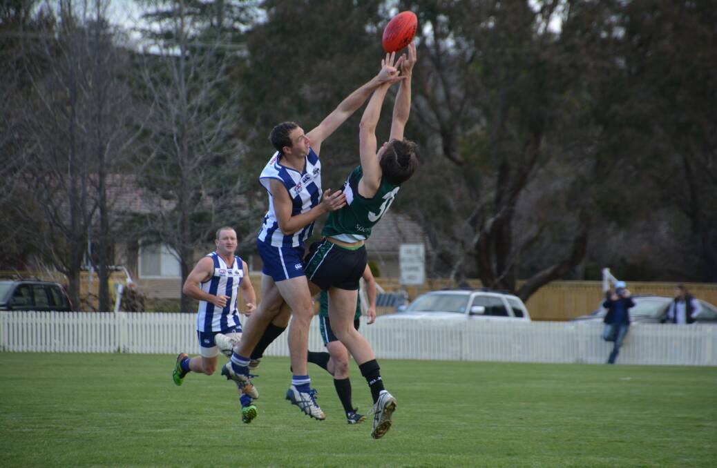 Tim Keys flies above Carl Frazier in the semi-final match against the Roos. 
