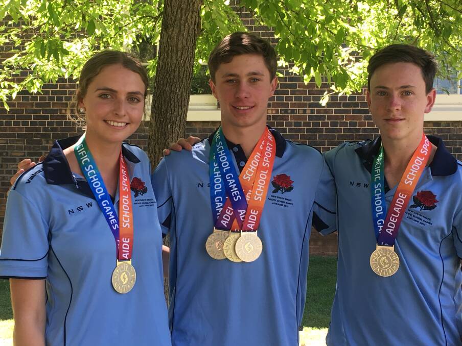 PODIUM: Mitch Hayden, centred, cleaned up in the pool while hockey stars Mia Emanuel and Nathan Czinner claimed silver at the Pacific Schools Games. 