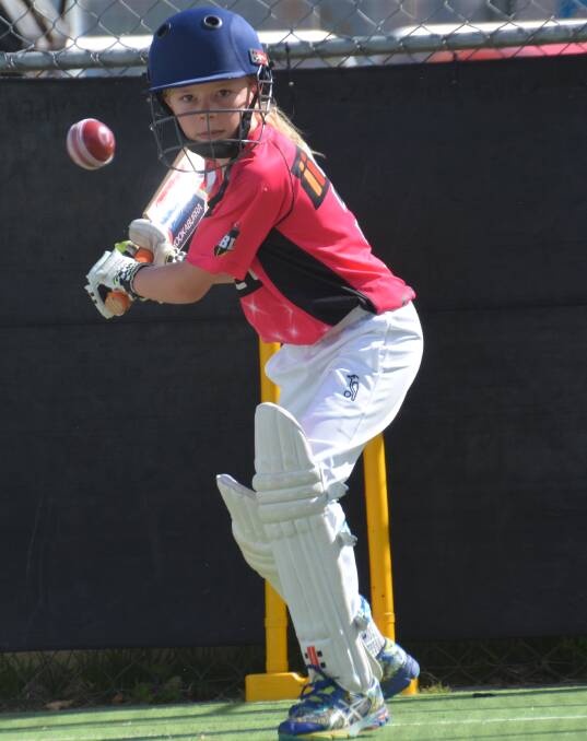 STEPPING UP: Young star Sophie Parsons worked on her batting skills in the nets session on Wednesday. 