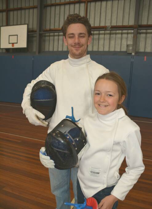 FUN AND FITNESS: Coach Matthew Shirley with youth fencer Amber Leitner.
