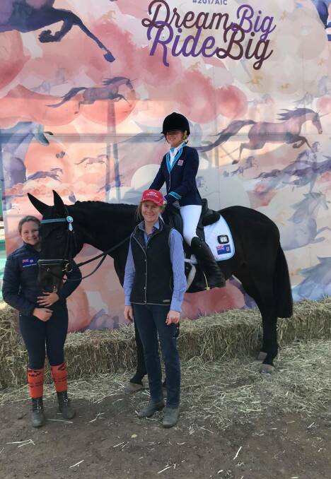 SADDLE UP: Charlotte Jacobson, Matilda Hall and Spelling Bee with NEGS dressage coach Rachelle Hirst. 