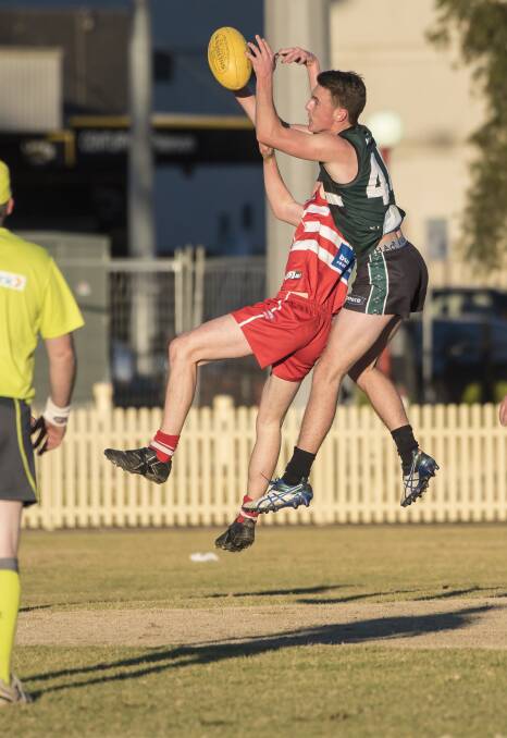 ABOVE THE PACK: Nomads' vice-captain Clarrie Barker was one of the side's best against Tamworth Swans. 