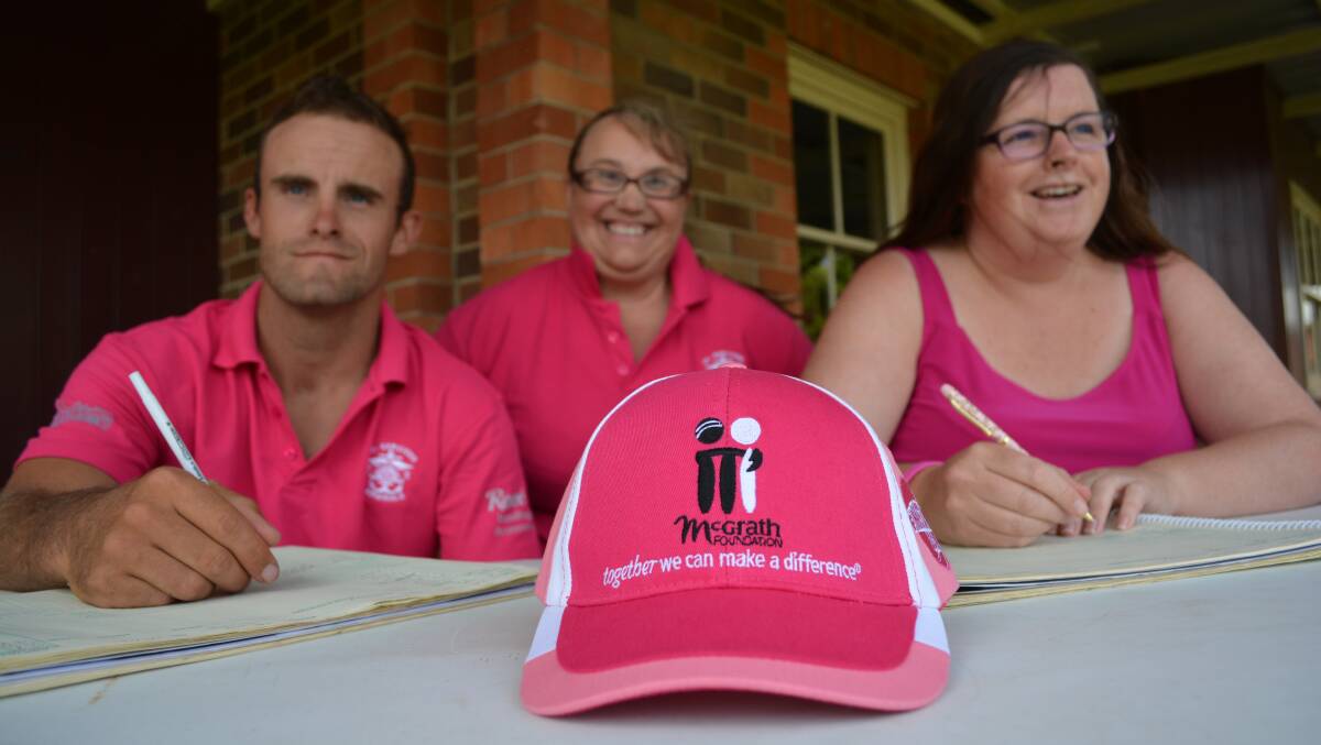 Even the scorers get into the spirit with John Elliot, Sue Lennon and Amanda Robins wearing their pink outfits in 2015's fundraiser. 
