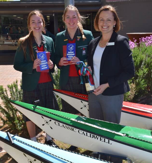 READY TO PADDLE:  Lucy McDonald and Anna Finney with Acting Principal Anna Caldwell. McDonald and Finney particpated in last year's Hawkesbury Canoe Classic race. 