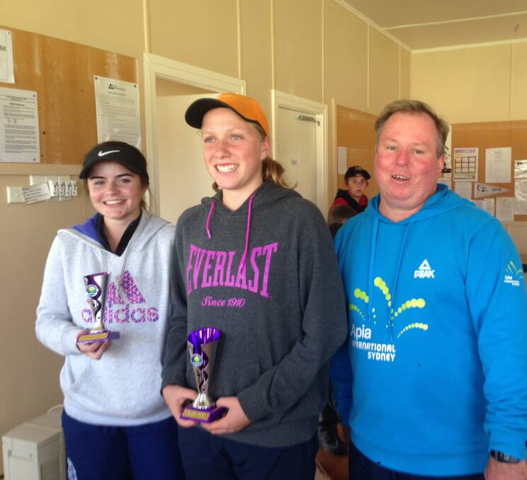 TROPHY HOLDERS: Under 16 players Sara Campbell and Jane Ervine with event organiser Rickie Withers.