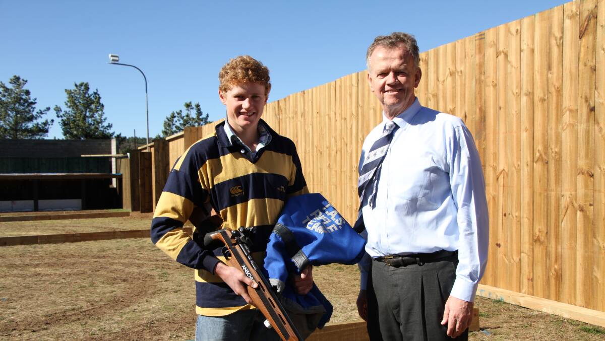 Sam Cannington is congratulated on his selection in the Combined AAGPS team by TAS Headmaster Murray Guest.